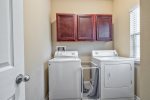 Utility room with full sized washer and dryer